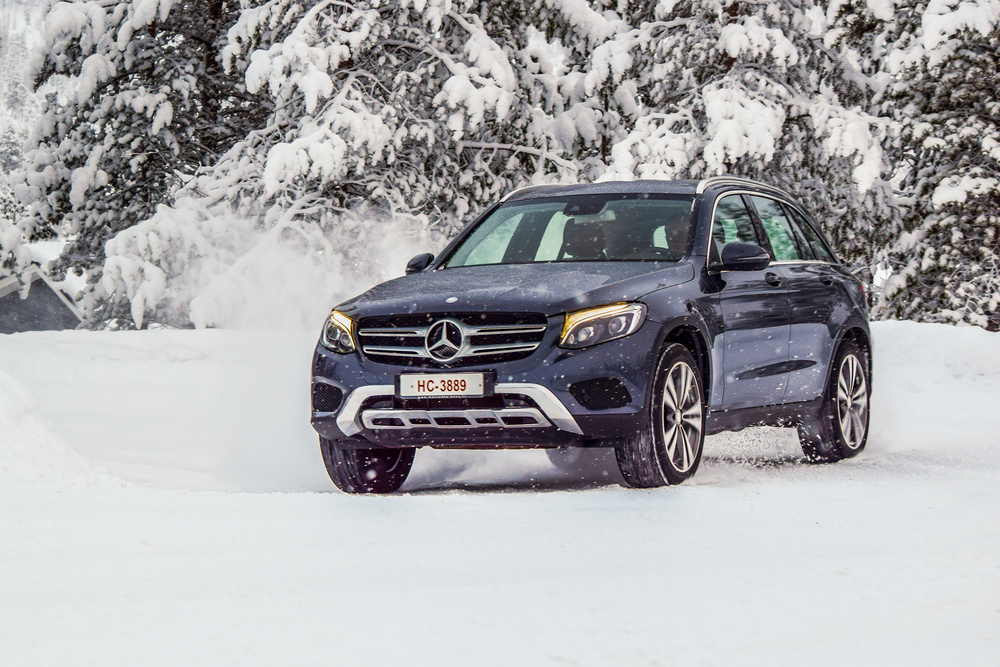 Mercedes-Benz 4MATIC SUV driving in snow, Mercedes-Benz of Westminster winter maintenance, AWD traction Colorado Front Range, Mercedes winter driving Westminster CO, 4MATIC performance on icy road, Mercedes SUV snow handling Denver metro, Colorado winter preparedness for Mercedes-Benz, certified service near Westminster