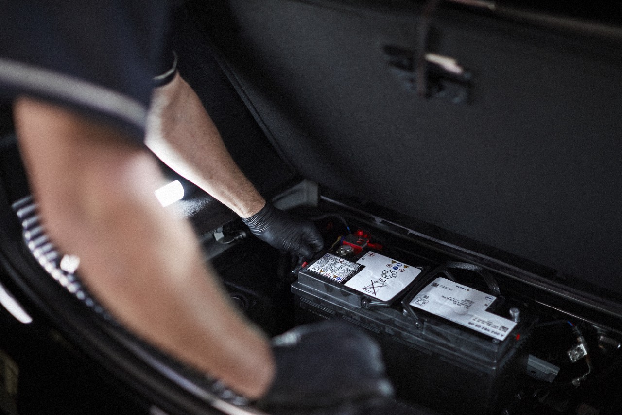 Mercedes-Benz technician replacing car battery, Mercedes-Benz of Westminster battery service, AGM battery replacement Westminster CO, Mercedes battery testing Denver Front Range, expert Mercedes mechanic checking trunk battery, Colorado winter battery prep for Mercedes-Benz, genuine Mercedes maintenance near Boulder and Denver, Westminster Mercedes service center battery inspection, holiday travel battery check for Mercedes SUVs