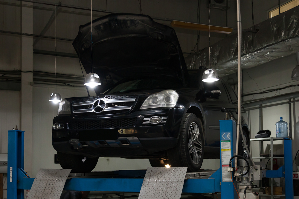 Mercedes-Benz of Westminster Service Center, Mercedes SUV on lift, certified Mercedes technician Colorado, high altitude maintenance Westminster CO, air filter replacement, coolant testing and thermostat inspection, turbocharger and intercooler evaluation, Service A Service B Express Service, complimentary loaner and pickup, Denver Broomfield Arvada