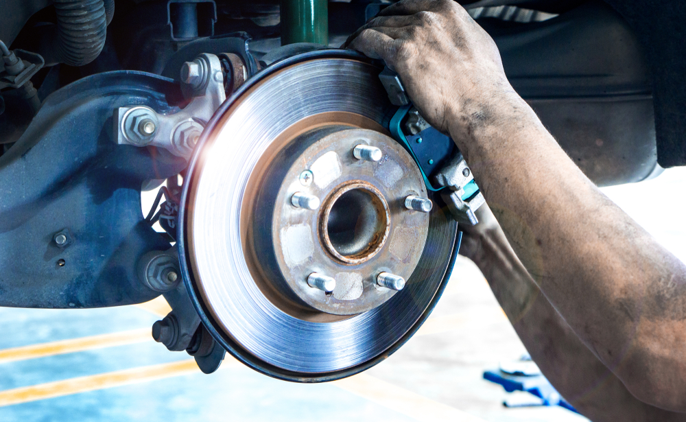 Mercedes brake rotor replacement Westminster CO, brake inspection Mercedes service center, OEM brake pad installation Westminster Mercedes, Mercedes mechanic checking brake system Colorado, Mercedes rotor wear inspection summer service