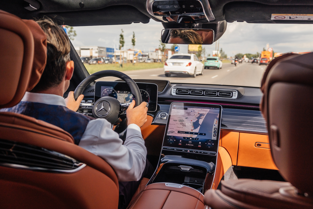Driving Mercedes-Benz on I-95 with A/C, Florida summer highway drive, Mercedes-Benz navigation Daytona Beach, luxury vehicle A/C in use, beat the heat with Mercedes-Benz service, cool and comfortable Florida road trip, Mercedes-Benz driver experience