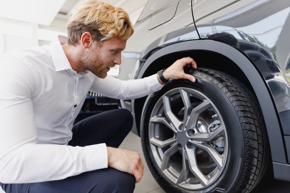 Mercedes-Benz tire inspection service Daytona Beach, luxury vehicle summer tire check, Mercedes tire tread depth check Florida, expert Mercedes-Benz tire service Daytona, checking for tire damage summer heat, Mercedes-Benz technician inspecting tires, tire safety inspection Mercedes-Benz service, luxury SUV tire checkup Florida dealership