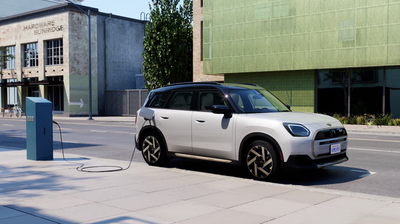 White MINI Countryman Electric parked at a charging station
