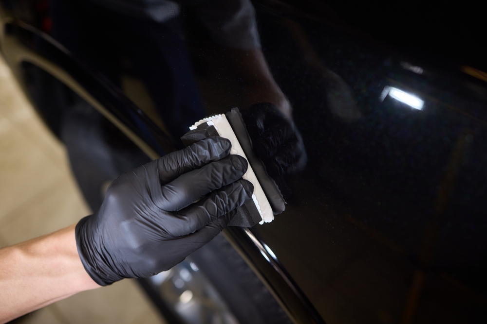 Ceramic coating UV protection Naples FL, applying paint protection Naples Premium Collision Center, professional ceramic coating dark vehicle, automotive ceramic sealant Naples, paint protection expert Southwest Florida, protect vehicle from sun damage Florida, UV coating application process Naples