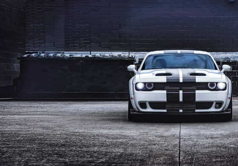 Dodge Challenger performance hero image, muscle car service Newnan GA, SRT Brembo brakes, widebody stance, HEMI maintenance experts, Mopar performance parts installation, Georgia muscle car tuning, Newnan CDJR Challenger specialists