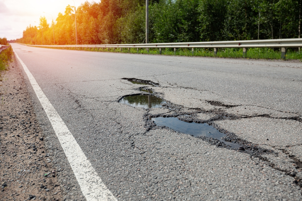 Georgia potholes on Bullsboro Drive Newnan GA, rough roads causing suspension wear, wheel alignment issues, tire damage risk, Jeep Grand Cherokee maintenance Georgia, Coweta County road conditions, proactive suspension checks, shock and strut service, Newnan CDJR Service center near I-85, safety inspection