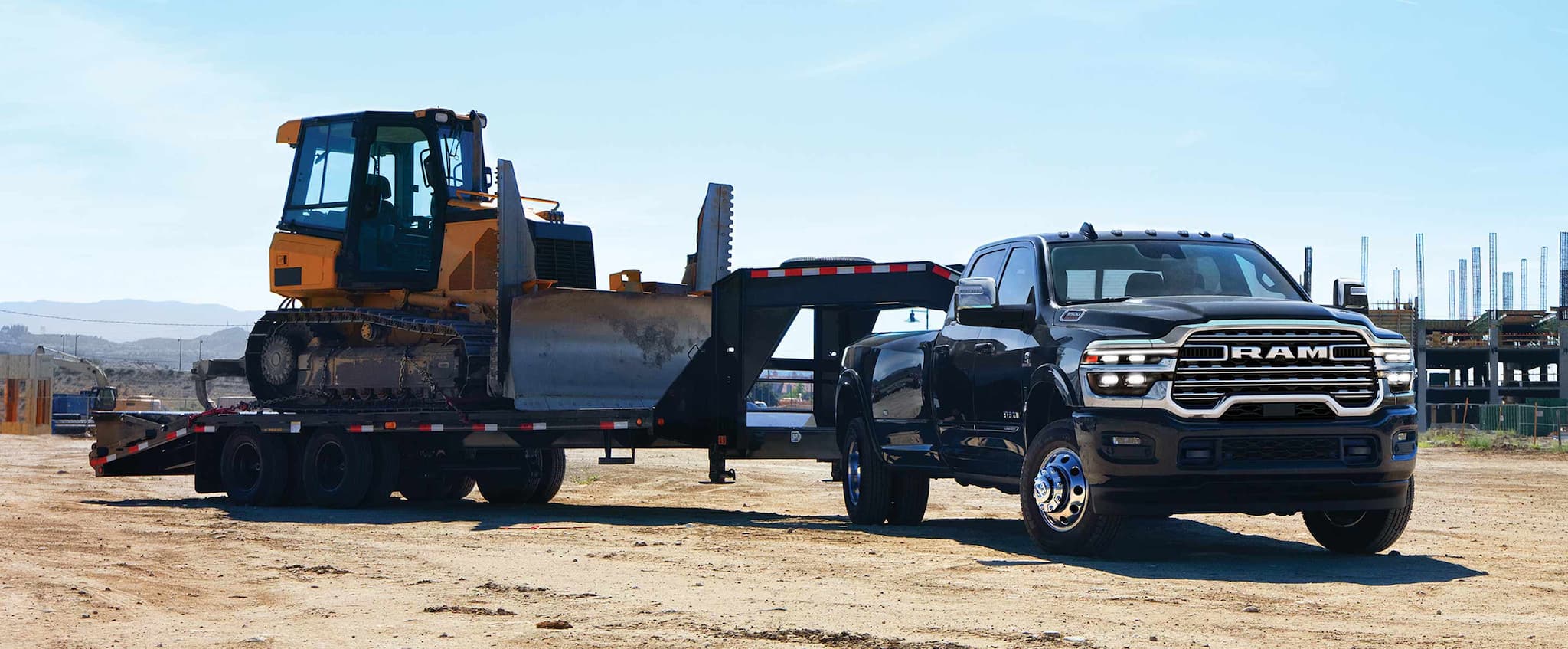 Ram 1500 towing UTV on trailer, hero image, weekend hauling to West Point Lake Georgia, Ram 1500 towing capacity, Newnan Peachtree Chrysler Dodge Jeep Ram, schedule pre-tow inspection, Ram 1500 towing maintenance Newnan GA
