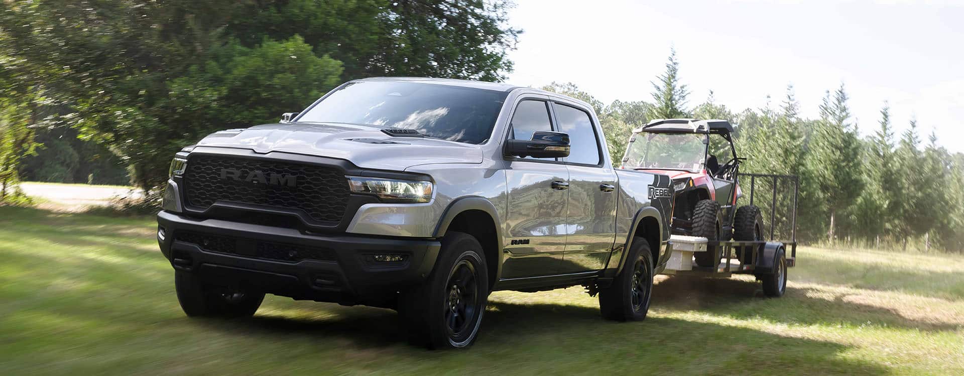 Ram truck towing heavy equipment on gooseneck trailer at job site, commercial hauling Georgia, Ram 1500/2500 towing best practices, Newnan Peachtree CDJR fleet service, towing safety checklist, schedule Ram service in Newnan GA