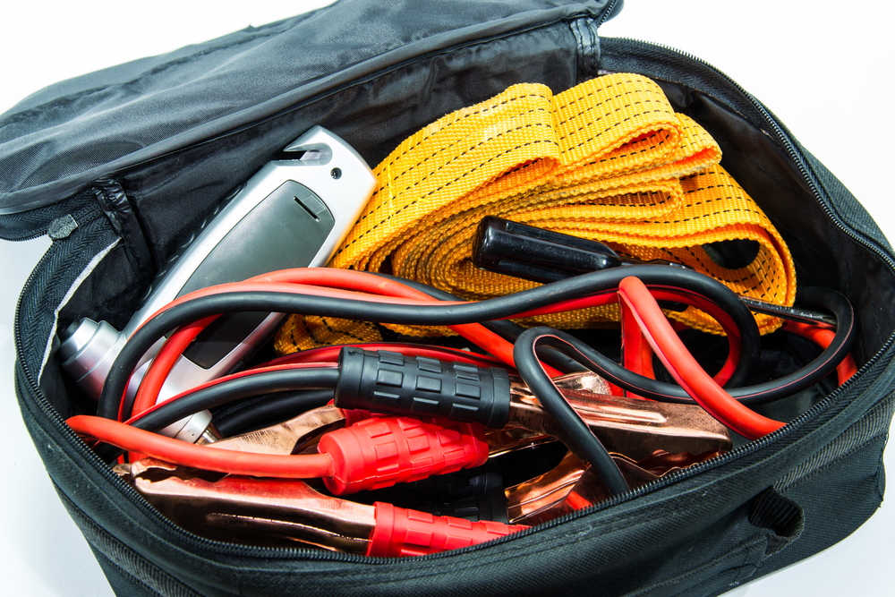 Emergency road trip kit, summer driving essentials, jumper cables and phone charger kit, roadside safety CDJR Newnan GA, heatwave car emergency supplies, Georgia summer car emergency gear, Dodge Ram roadside preparedness, Jeep Grand Cherokee travel safety kit