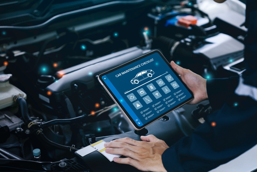 Summer vehicle inspection checklist, CDJR new car summer prep, technician using digital maintenance tool, Ram 1500 pre-trip inspection, Jeep Grand Cherokee summer diagnostics, Newnan Peachtree CDJR certified service, Georgia heat vehicle inspection, Dodge summer readiness inspection