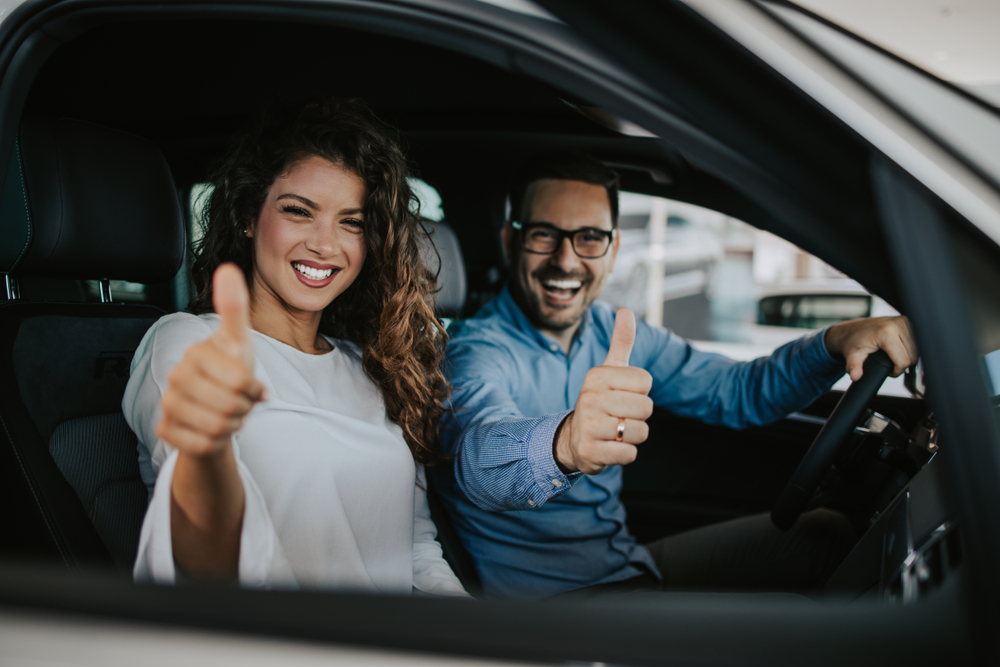 Happy Nissan driver Cookeville TN, comfortable Nissan cabin after A/C service, customer thumbs up Nissan of Cookeville, reliable A/C repair results, Car air conditioning service satisfaction