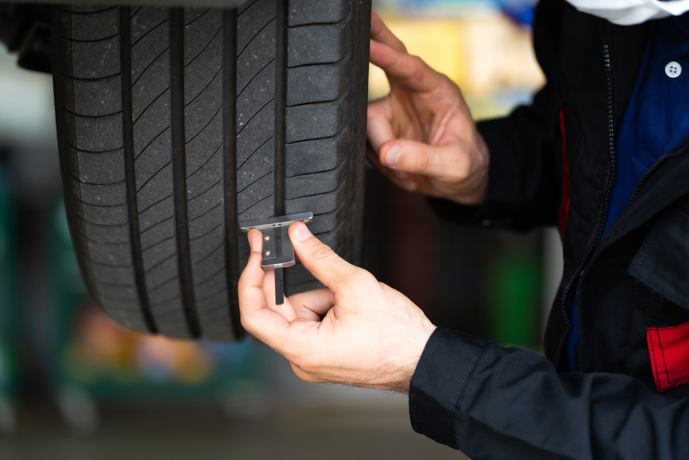 Tire tread depth check Nissan Cookeville TN, summer tire maintenance Cookeville, Cumberland Plateau tire inspection, Nissan of Cookeville tire wear check, heat stress tire damage, professional tire service in Tennessee, Nissan tire rotation prep, tread depth gauge Nissan service