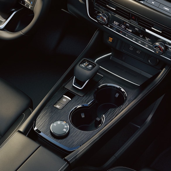 Nissan center console gear shifter interior, CVT transmission driving experience smooth acceleration, Nissan Altima Rogue Sentra interior detail, Gainesville FL CVT maintenance, use Genuine Nissan CVT Fluid NS-3, dealership transmission service Gainesville, schedule CVT inspection online Gainesville Nissan Service