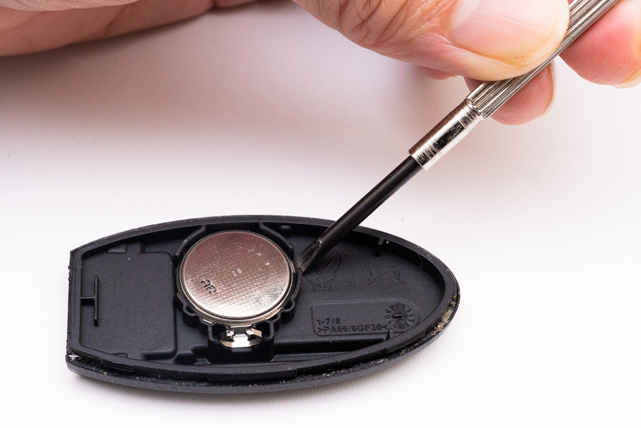 Nissan key fob battery replacement, CR2032 installation, Nissan Rogue key fob DIY fix, how to change Nissan key battery Charlotte NC, key fob coin battery install East Charlotte Nissan service
