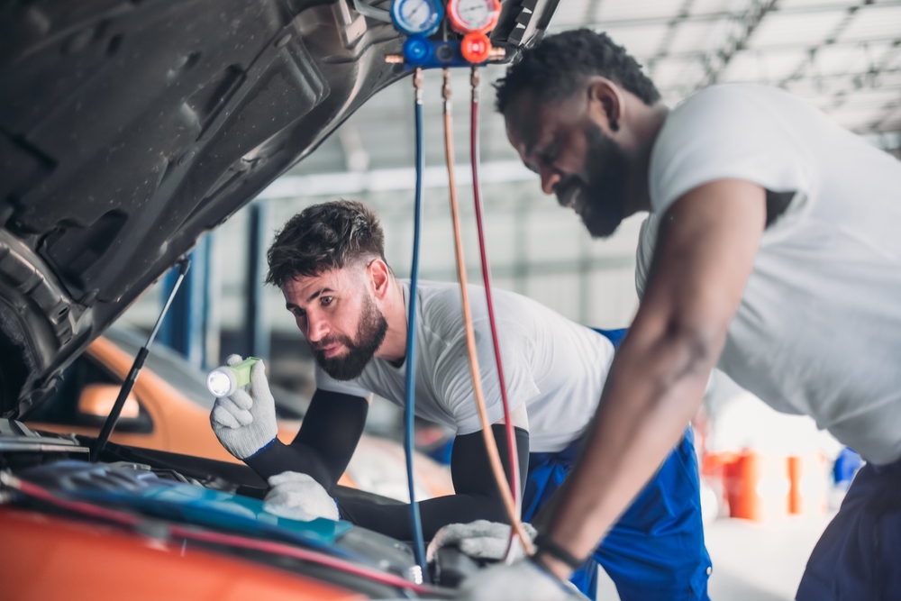 Nissan A/C service Athens GA, car air conditioning repair, professional auto A/C maintenance Athens Georgia, certified Nissan technicians working on A/C, Nissan of Athens car service, Georgia summer car cooling system check, Athens GA automotive repair shop