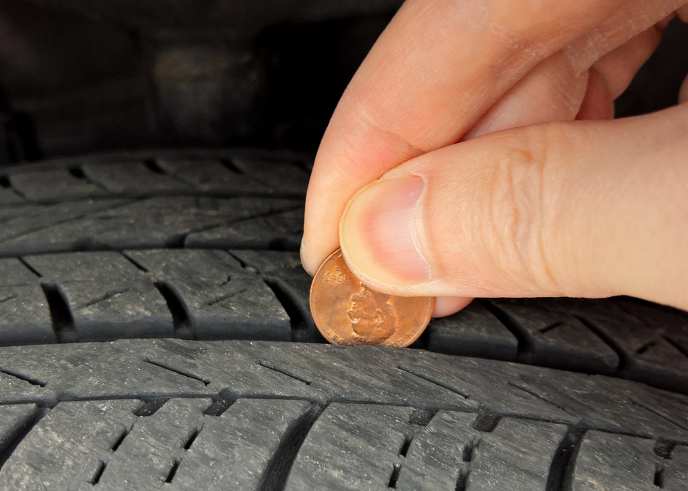 Mercedes-Benz tire tread depth, penny test tire wear check, tire safety summer driving Long Island, check Mercedes-Benz tires before road trip, worn tire replacement signs, tire inspection tips Mercedes Massapequa