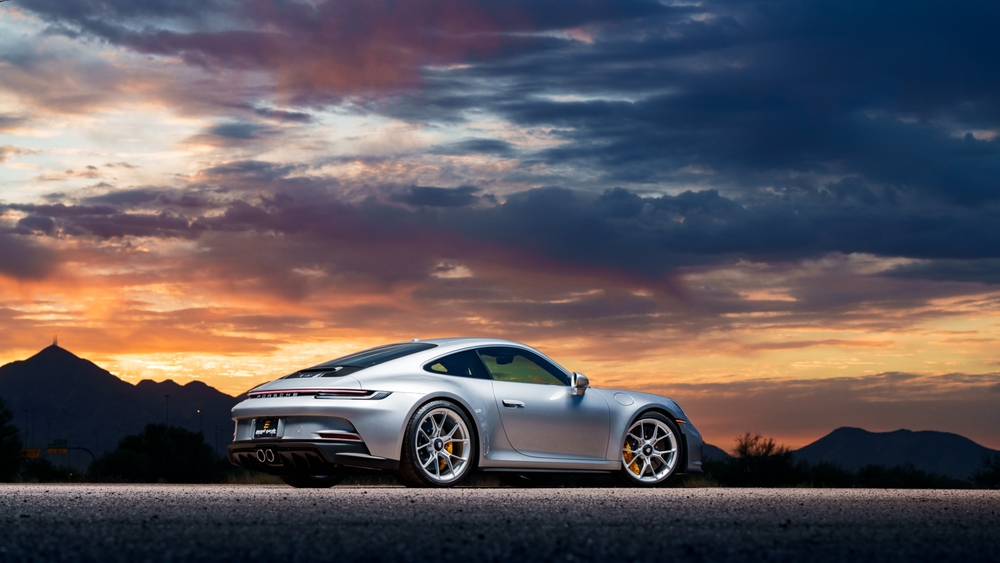 Porsche 911 silver coupe at sunset, luxury car Florida Gulf Coast, high-end performance vehicle in Naples, scenic Porsche drive Southwest Florida, Porsche 911 Carrera S photo shoot, premium sports car with sunset backdrop, buy Porsche Naples FL, Porsche dealership Naples, new Porsche for sale Naples, Porsche lease deals Naples FL, how to buy a Porsche in Naples, custom Porsche Naples