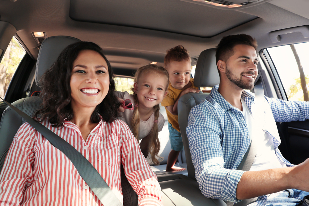 family in Nissan SUV driving to school, Charlotte NC school run safety, Nissan Rogue family vehicle, back to school car prep Charlotte, Scott Clark Nissan safe driving, Charlotte family vehicle maintenance