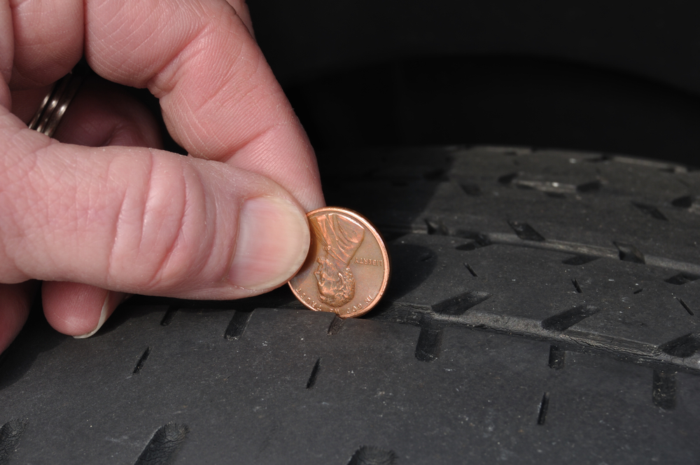 Nissan tire tread depth check, penny test for worn tires, Stone Mountain tire inspection, Georgia school season driving safety, back to school tire replacement Lilburn, Nissan alignment and tire service