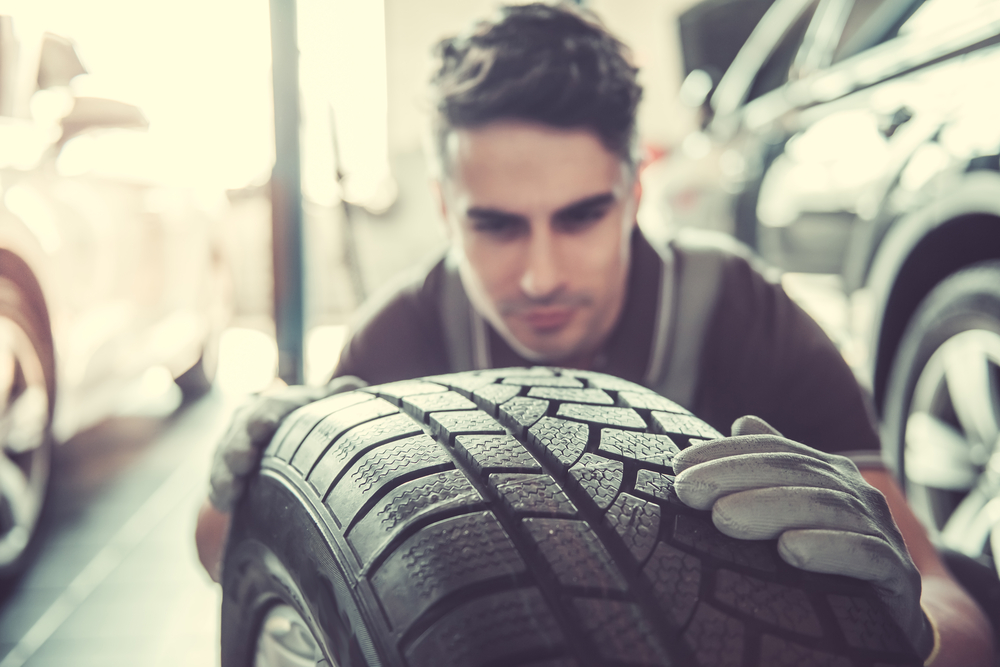 Volkswagen tire inspection Stone Mountain VW, VW service center Snellville GA, mechanic checking tire tread depth VW, back to school tire safety Volkswagen, proper traction for school zone driving
