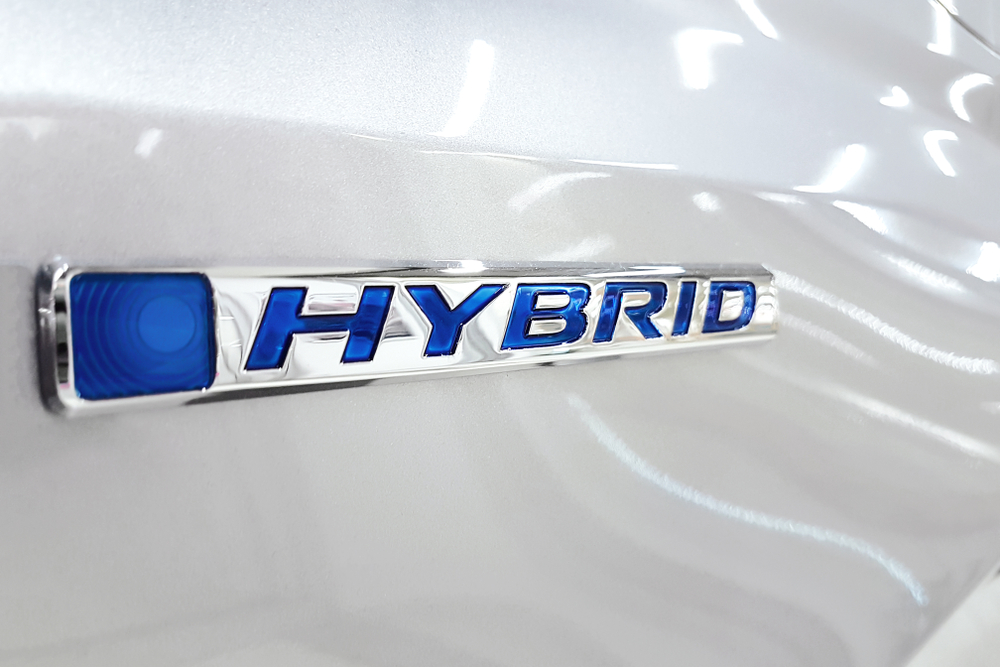 Hybrid badge close-up on Toyota, Prius RAV4 Camry Hybrid emblem, Toyota hybrid battery maintenance Knoxville TN, hybrid cooling filter service, ToyotaCare hybrid battery warranty information, Toyota Knoxville service specials, hybrid battery lifespan tips