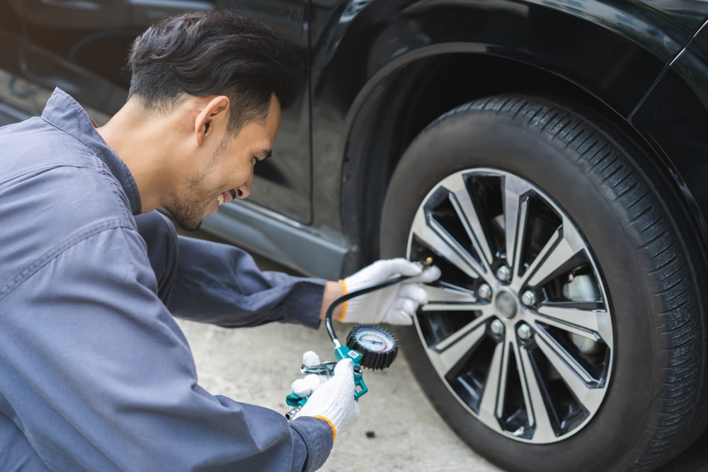 Toyota tire pressure check Knoxville, summer road trip tire prep, Toyota-certified technician checking tire pressure, pre-trip safety inspection Tennessee, tire air pressure test Toyota service Knoxville
