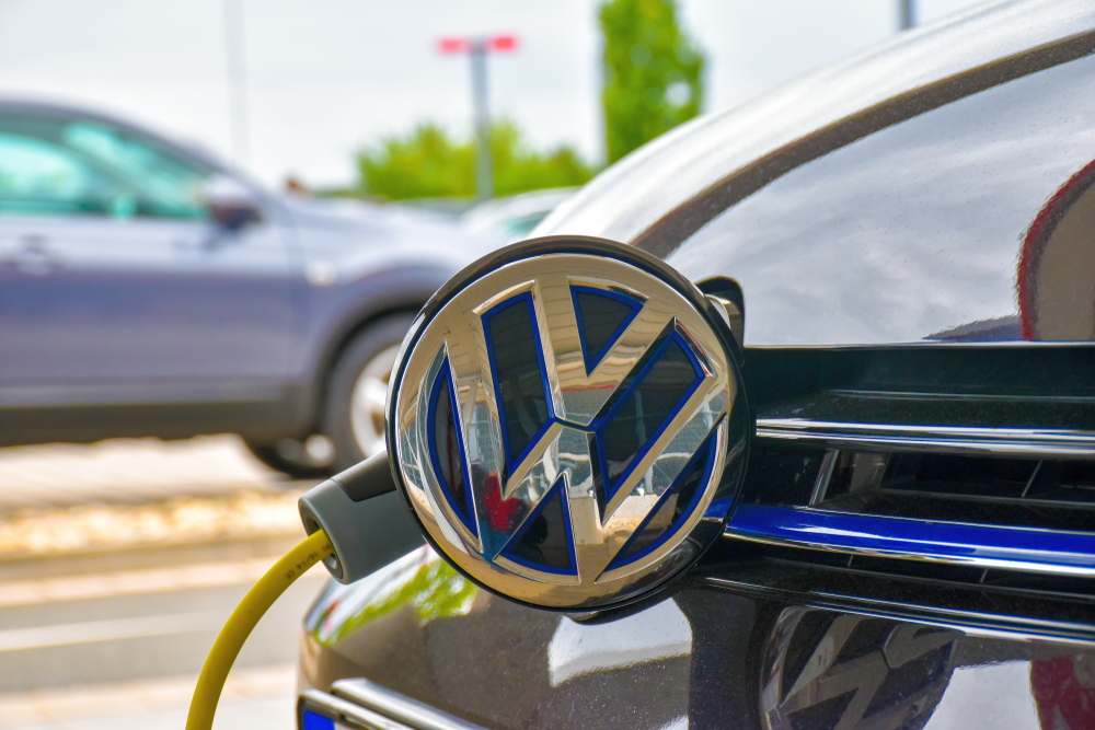 Technician performing Volkswagen EV battery diagnostic check in Snellville service center
