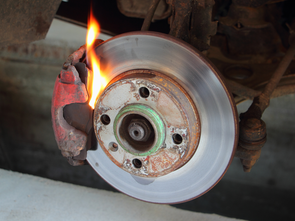 overheated brake rotor on mountain descent, hot brakes failure Colorado Springs, brake fire from worn pads, dangerous mountain road braking, Nissan brake rotor damage, brake failure warning signs, Woodmen Nissan brake service emergency